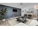 Living room with gray brick fireplace and modern decor at 2116 Fuller Rd, Las Vegas, NV 89108