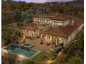 Stunning aerial view of a luxurious estate at dusk at 22 Rue Grimaldi Way, Henderson, NV 89011