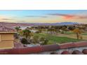Lake and golf course view from home's balcony at sunset at 22 Rue Grimaldi Way, Henderson, NV 89011