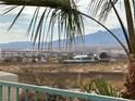 Community view with lake, waterpark, and mountain backdrop at 3550 Bay Sands Dr # 1017, Laughlin, NV 89029