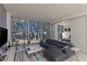 Modern living room with floor to ceiling windows and city views at 3726 Las Vegas Blvd # 705, Las Vegas, NV 89158