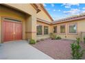 Front entry with double doors and small courtyard at 3757 Brittany Nicole Ct, Las Vegas, NV 89139