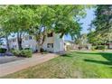 Building exterior with green lawn and trees at 4770 Topaz St # 77, Las Vegas, NV 89121