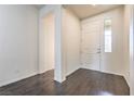 Bright entryway with wood-look flooring and access to interior rooms at 4880 Da Vinci Way, Pahrump, NV 89061