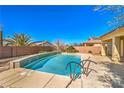 Inviting rectangular pool with a tiled coping and metal ladder at 4880 Da Vinci Way, Pahrump, NV 89061