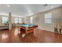 Game room featuring a pool table and hardwood floors at 5863 Capsicum Ct, Las Vegas, NV 89118