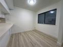 Dining area with light gray laminate flooring and neutral walls at 5905 Smoke Ranch Rd # A, Las Vegas, NV 89108