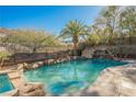 Resort-style pool with waterfall, slide, and spa at 646 Saint Croix St, Henderson, NV 89012