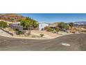 Charming single-story home with covered parking and low-maintenance front yard landscaping at 648 Mount Blackburn Ln, Boulder City, NV 89005