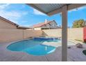 Backyard with a private pool, hot tub, and privacy wall at 6586 W Mesa Vista Ave, Las Vegas, NV 89118