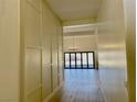 Bright and spacious entryway with modern wall paneling and a view to the living area at 7405 Chorleywood Way, Las Vegas, NV 89131