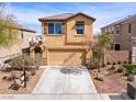 Inviting two-story home with desert landscaping, two-car garage and covered entryway, creating curb appeal at 1012 Water Cove St, Henderson, NV 89011