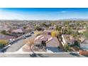 Single-story home in a residential neighborhood with a three-car garage at 10201 Los Padres Pl, Las Vegas, NV 89134