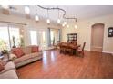 Bright dining room with hardwood floors and access to a patio at 10718 Del Rudini St, Las Vegas, NV 89141