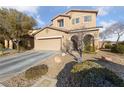 Two story home with a two car garage and low maintenance desert landscaping at 11290 Hazel Rock St, Las Vegas, NV 89179