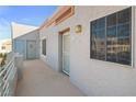 Building hallway with entrance to unit, security screen door, and window at 2044 Mesquite Ln # 302, Laughlin, NV 89029