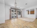 Bright dining room featuring tile floors and access to the backyard patio at 3020 Via Venezia, Henderson, NV 89052