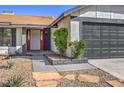 Landscaped front yard with stone pathway leading to the red front door at 3425 Irv Marcus Dr, Las Vegas, NV 89108