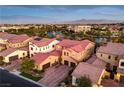 Luxury homes community with lake and mountain views at dusk at 4063 Villa Rafael Dr, Las Vegas, NV 89141