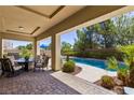 Relaxing backyard oasis with a private pool and covered patio at 4063 Villa Rafael Dr, Las Vegas, NV 89141