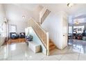 Bright entryway with tiled floors and staircase at 4116 W Delhi Ave, North Las Vegas, NV 89032