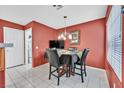 Small dining area with four chairs and a view to kitchen at 422 Blush Creek Pl, Las Vegas, NV 89144