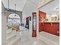 Bright entryway with staircase, wood flooring, and view to living room at 422 Blush Creek Pl, Las Vegas, NV 89144