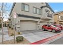 Two-story townhome with attached two-car garage at 4655 Fuchsia Nights Ave # 103, North Las Vegas, NV 89084