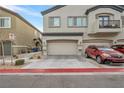 Two-story townhome with attached two-car garage at 4655 Fuchsia Nights Ave # 103, North Las Vegas, NV 89084