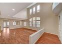 Two story living room with hardwood floors and high ceilings at 6504 Birdcall St, North Las Vegas, NV 89084