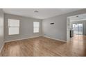 Living room with light gray walls and wood-look flooring at 6536 Elk Creek Ln, Las Vegas, NV 89156