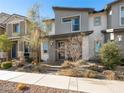 Two story home with gray exterior, landscaping, and walkway at 686 Last Dance Pl, Henderson, NV 89011