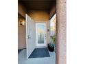 Inviting front entrance features a security screen door and decorative glass door at 7329 Restful Springs Ct, Las Vegas, NV 89128