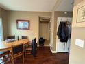 Casual dining area features hardwood floors and a wooden table with seating for four at 8396 Waylon Ave, Las Vegas, NV 89178