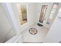 Bright entryway with tile flooring and a decorative door at 8428 Summers Ranch Ct, Las Vegas, NV 89139