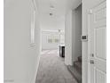 Bright entryway with stairs leading upstairs and view to living room at 2932 Torreon Ln, Las Vegas, NV 89121