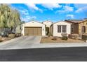 Charming single-story home with a two car garage and well-maintained landscaping at 3740 Corte Bella Hills Ave, North Las Vegas, NV 89081