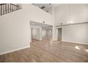 High ceiling living area with hardwood floors and lots of natural light at 4712 Stable Way, North Las Vegas, NV 89032