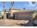 Single-story house featuring a two-car garage and desert landscaping at 520 Summer Mesa Dr, Las Vegas, NV 89144