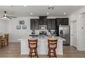 Modern kitchen with island, stainless steel appliances, and dark cabinets at 7230 N Decatur Blvd # 6, Las Vegas, NV 89131