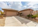 Two-car garage with attached storage space at 7830 Lyrebird Dr, North Las Vegas, NV 89084