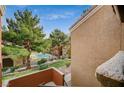 View from balcony overlooking a community pool and green space at 8101 W Flamingo Rd # 2080, Las Vegas, NV 89147