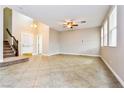 Spacious living room with tile floors and high ceilings at 989 Crescent Falls St, Henderson, NV 89011