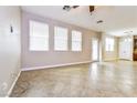 Bright living room with tile floors and access to backyard at 989 Crescent Falls St, Henderson, NV 89011