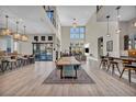 Large dining area with a live-edge table and modern chairs, perfect for entertaining at 10896 Tranquil Hills Way, Las Vegas, NV 89135