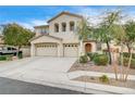 Two-story house with beige exterior, three-car garage, and landscaping at 221 Raptors View Ave, North Las Vegas, NV 89031