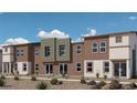 Contemporary townhome building showcasing clean lines and a neutral color palette at 2558 Petunia Garden Ave # 217, North Las Vegas, NV 89081