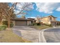 Single-story home with neutral exterior, attached garage, and landscaped yard at 3 Glendora Ct, Henderson, NV 89052