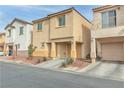 Two-story house with attached garage, and driveway, next to similar house at 4070 Emerald Wood St, Las Vegas, NV 89115