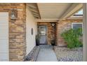 Inviting entryway with stone accents and a gray front door at 4089 Patterson Ave, Las Vegas, NV 89104